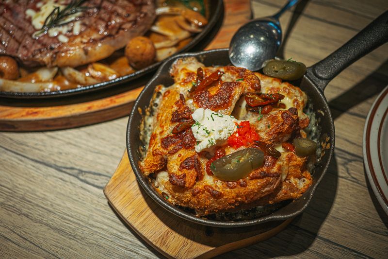 GYG loaded nachos with cheese, jalapeños and fresh toppings